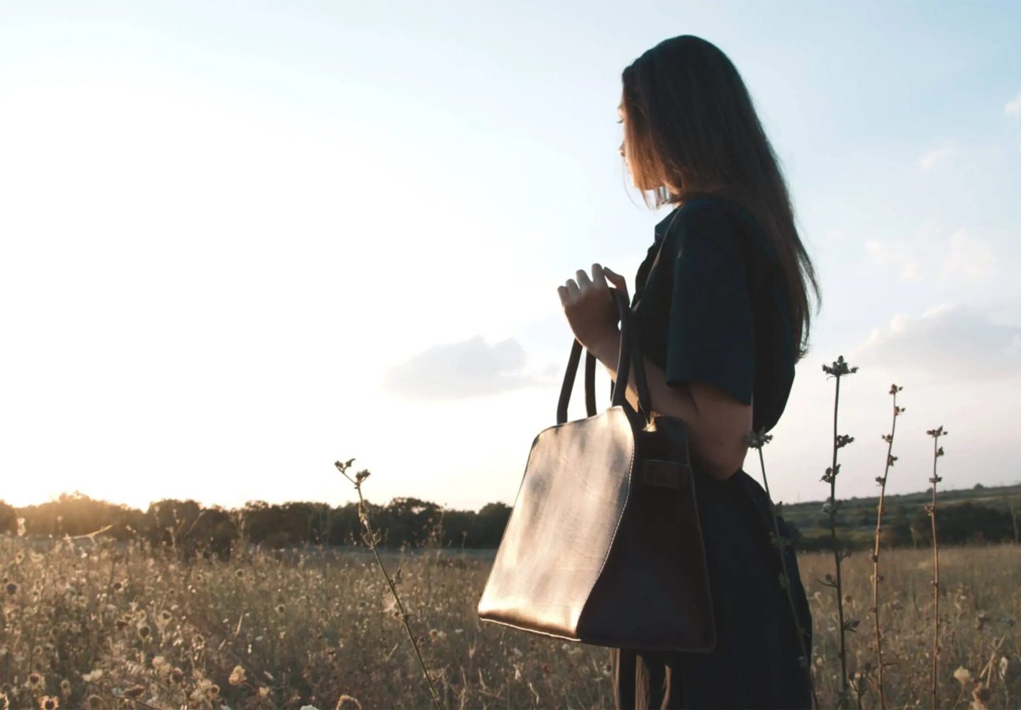 Woman Holding Corîu Italian Leather Handbag.