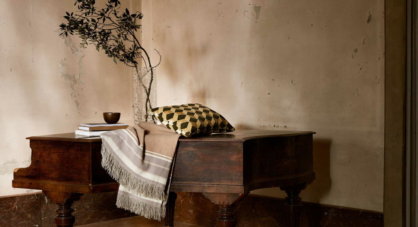 The House of Lyria Pillow and Throw on Piano