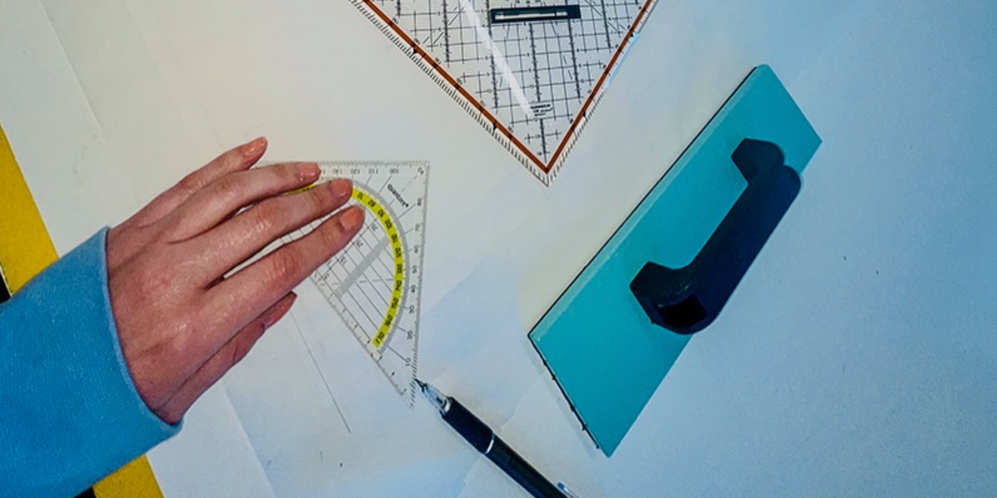 Schepers Bosman in the studio. An image of a hand with drawing tools.