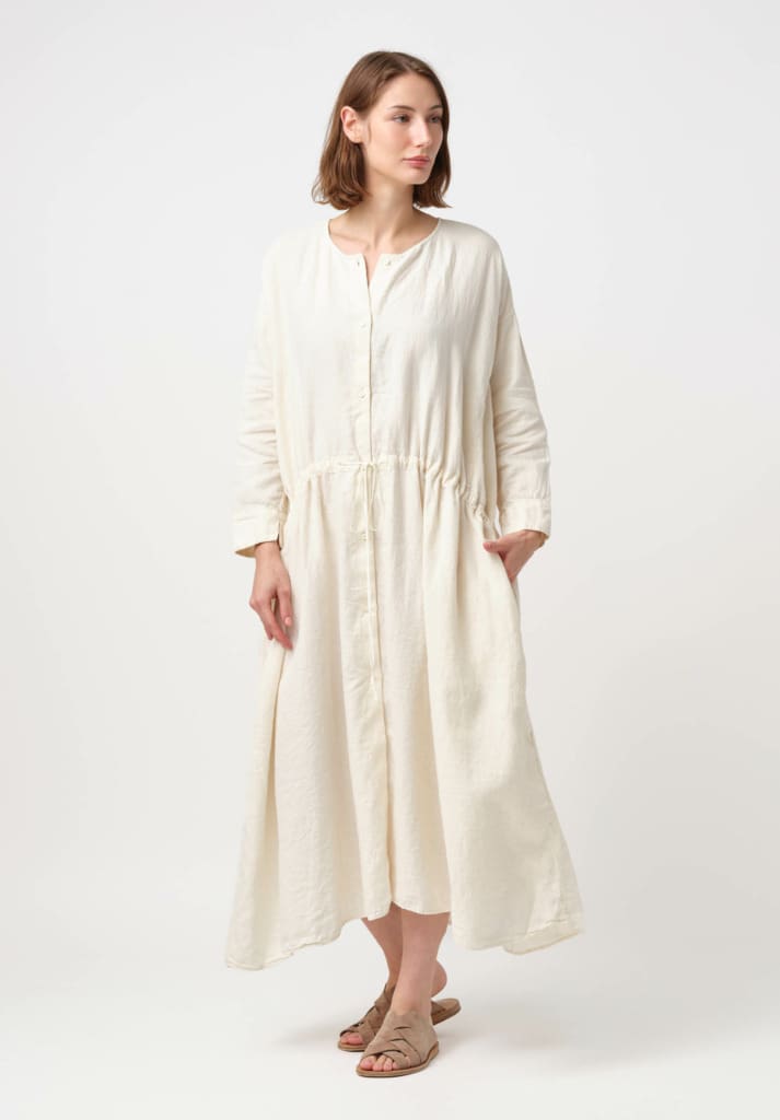 Model wearing Kaval Linen Twill Drawstring Waist Button-Down Dress in Vanilla Cream