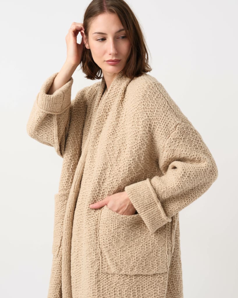 Model wearing Daniel Andresen Hand-Knit Camel Duranta Cardigan in Natural Whipped Honey